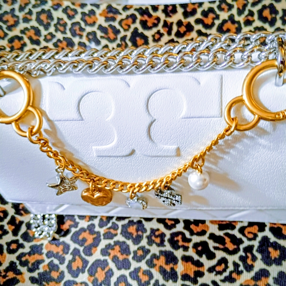 White Handbag with Gold and Silver Chain Accents